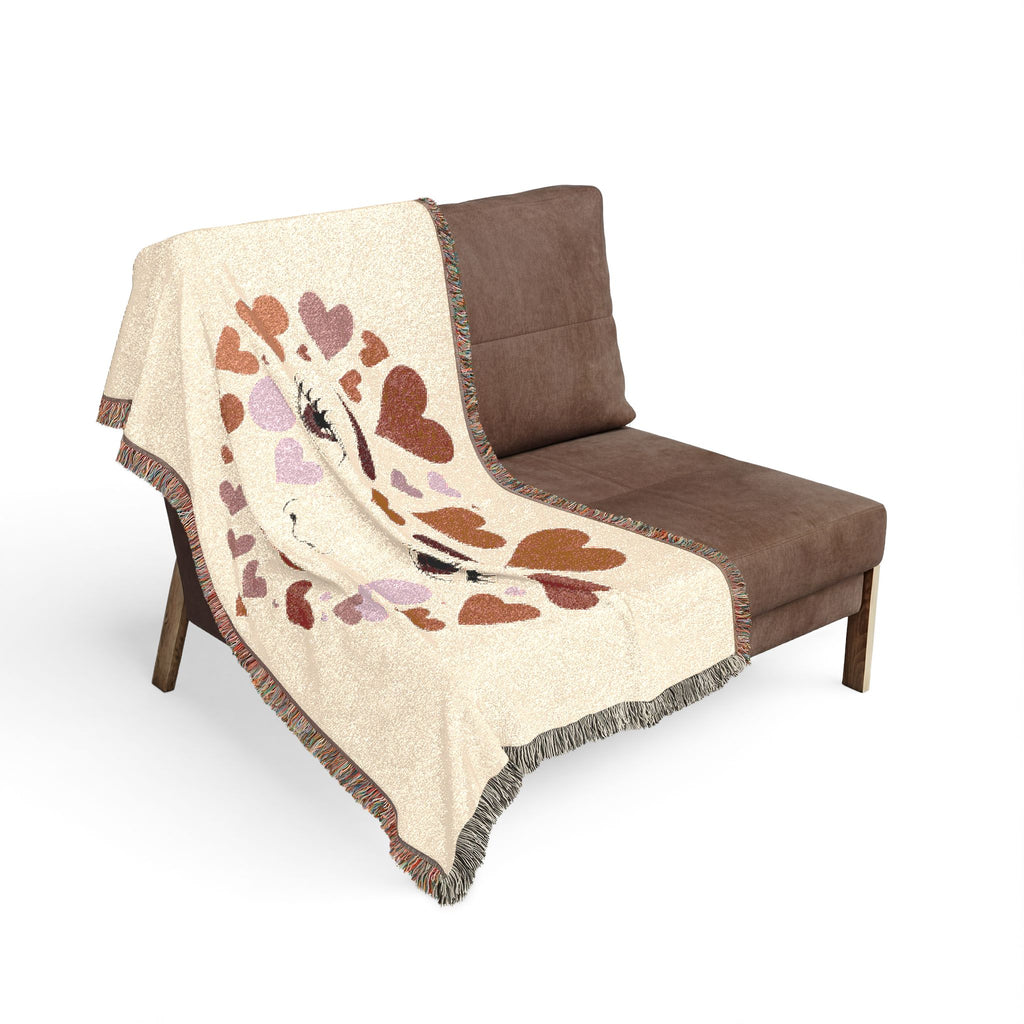 Brown chair with a patterned beige blanket draped over it on a white background