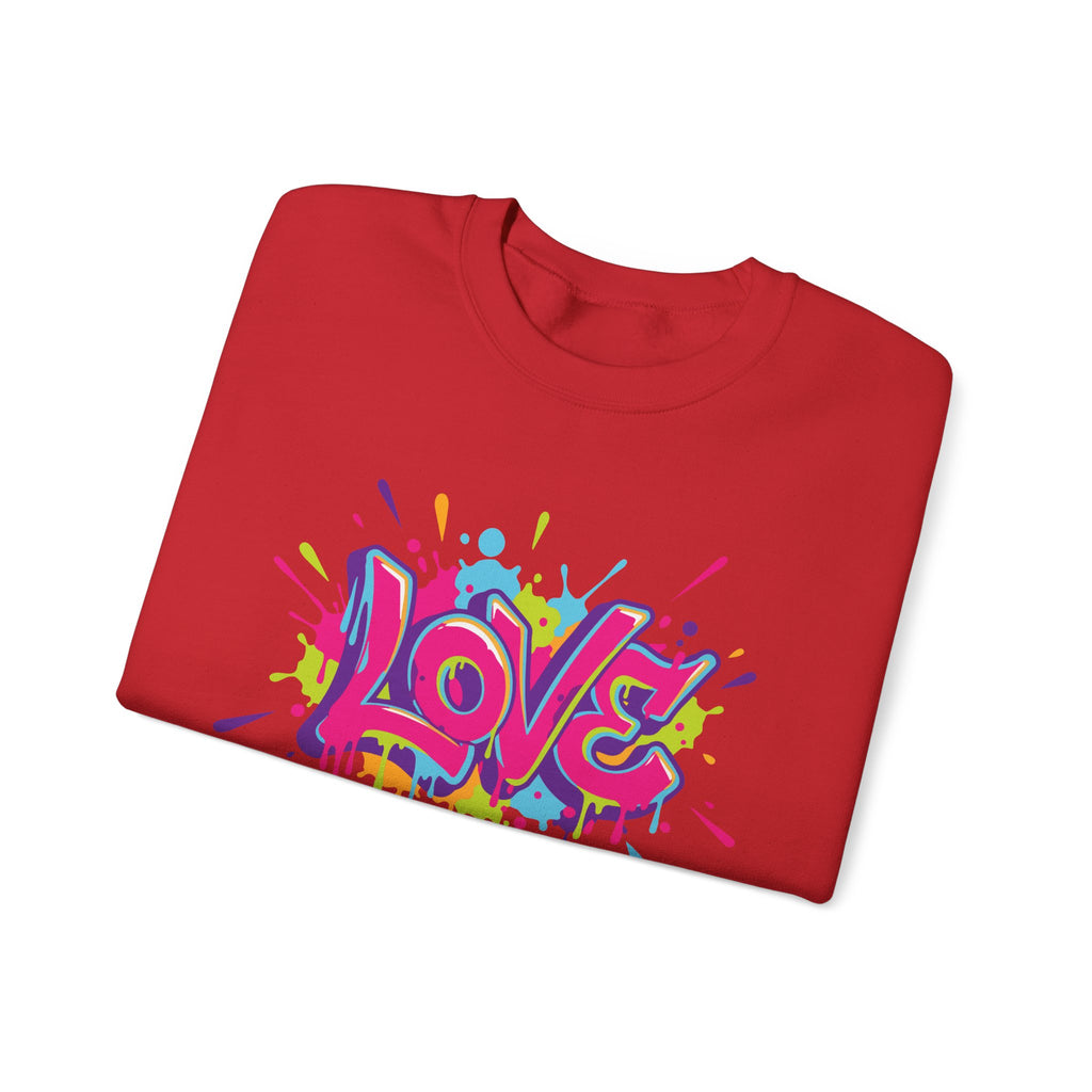 Folded red t-shirt with colorful 'LOVE' graphic on a white background