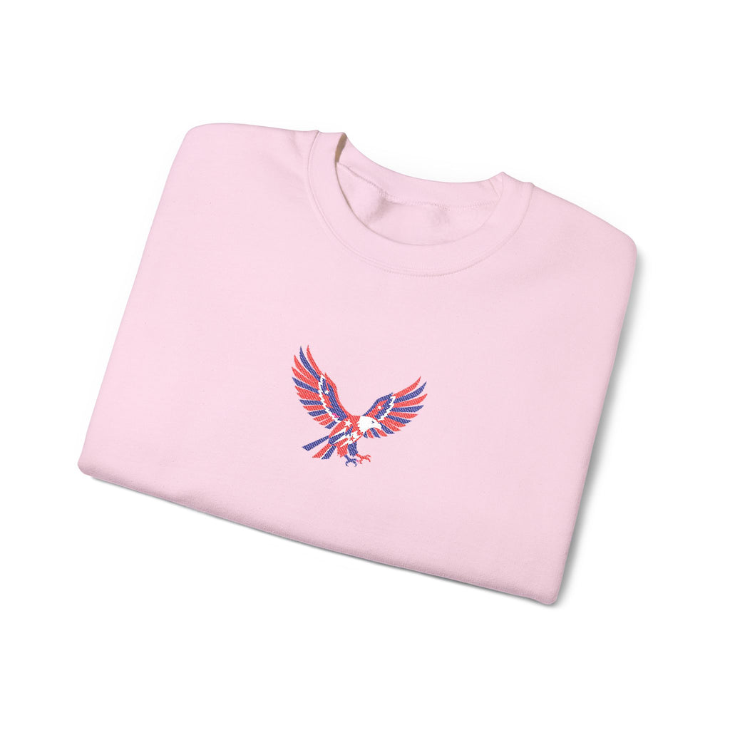 Folded pink sweatshirt with an eagle emblem on a white background