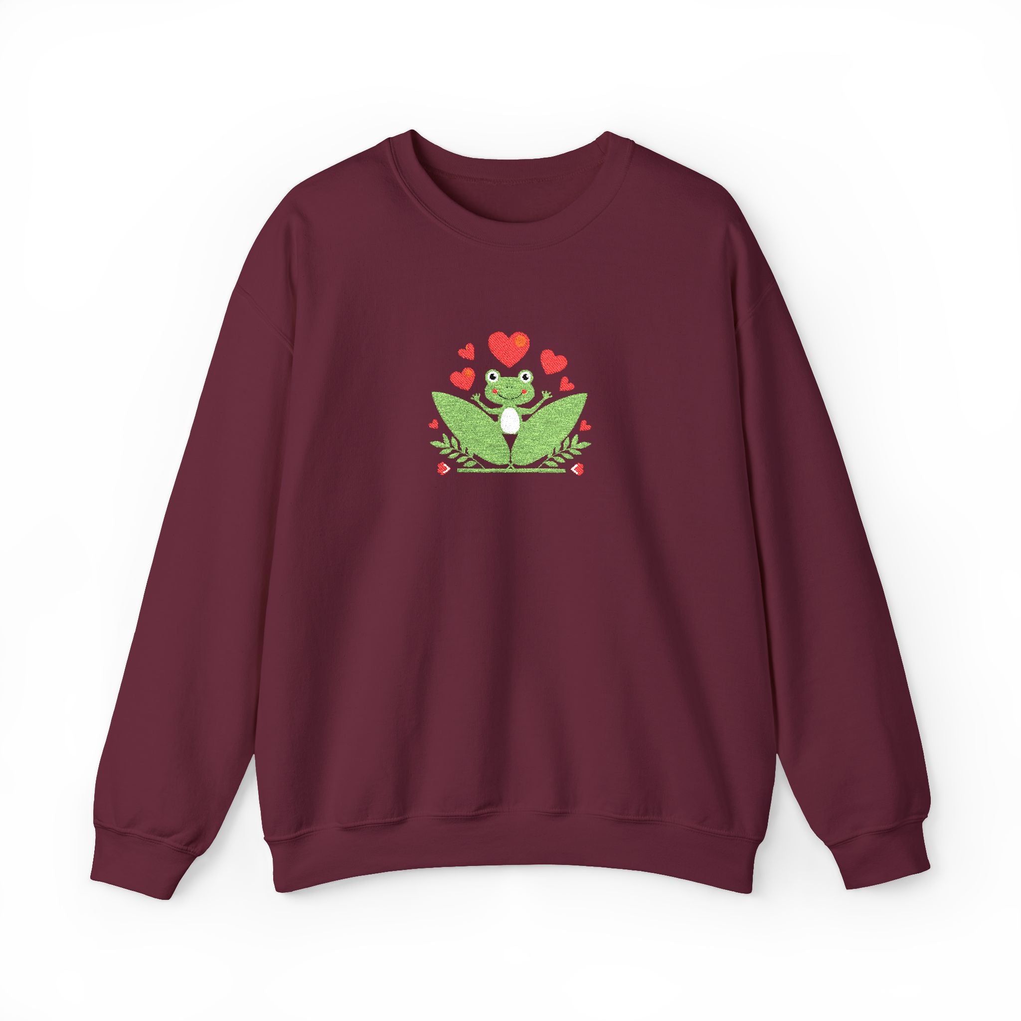 Maroon sweatshirt with a green frog graphic and red hearts on a white background