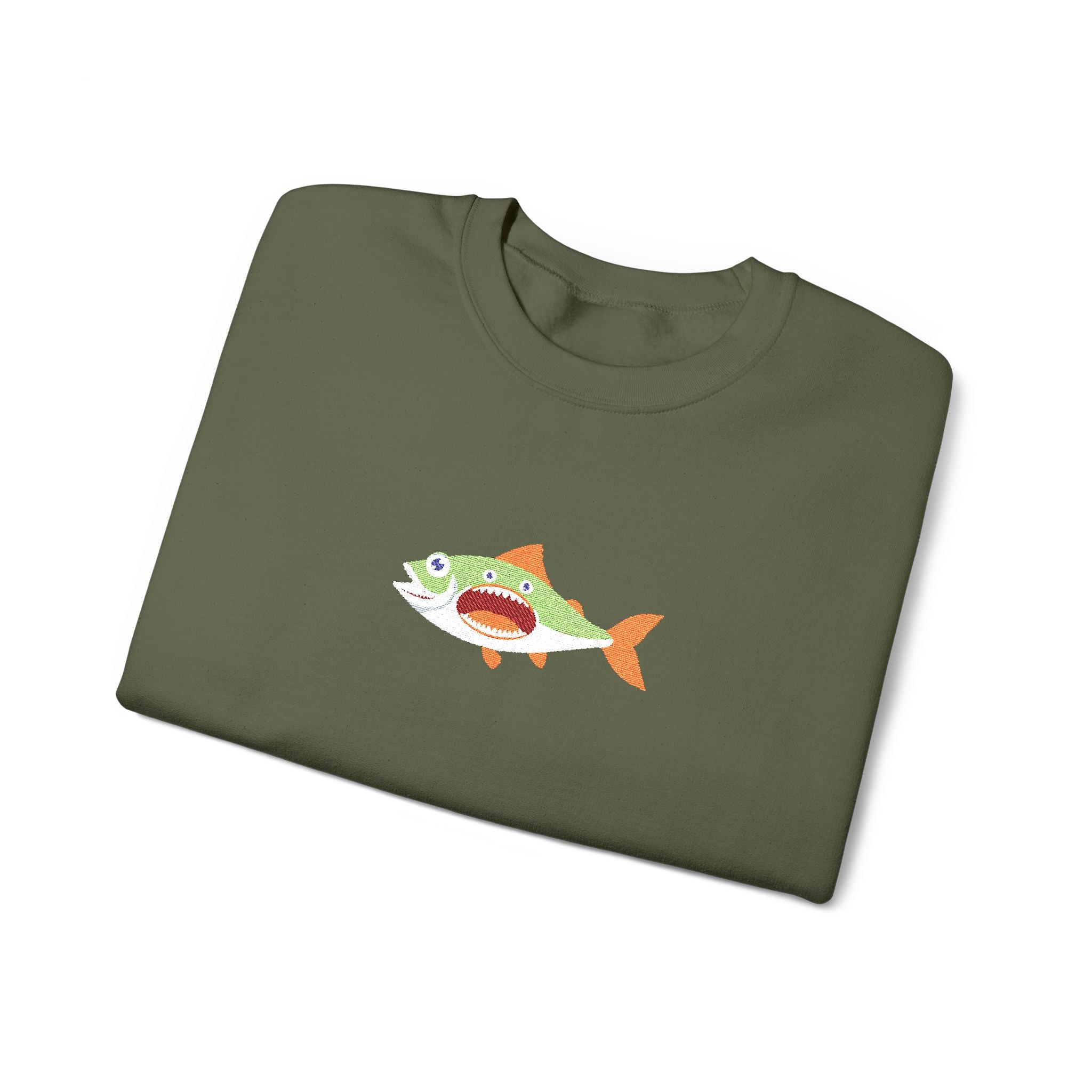 Folded green t-shirt with a fish graphic on a white background