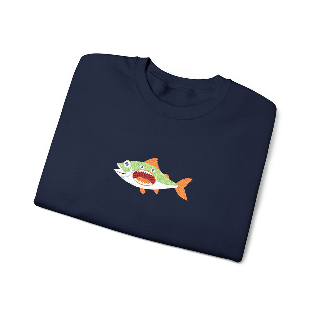 Folded dark gray t-shirt with a fish graphic on a white background
