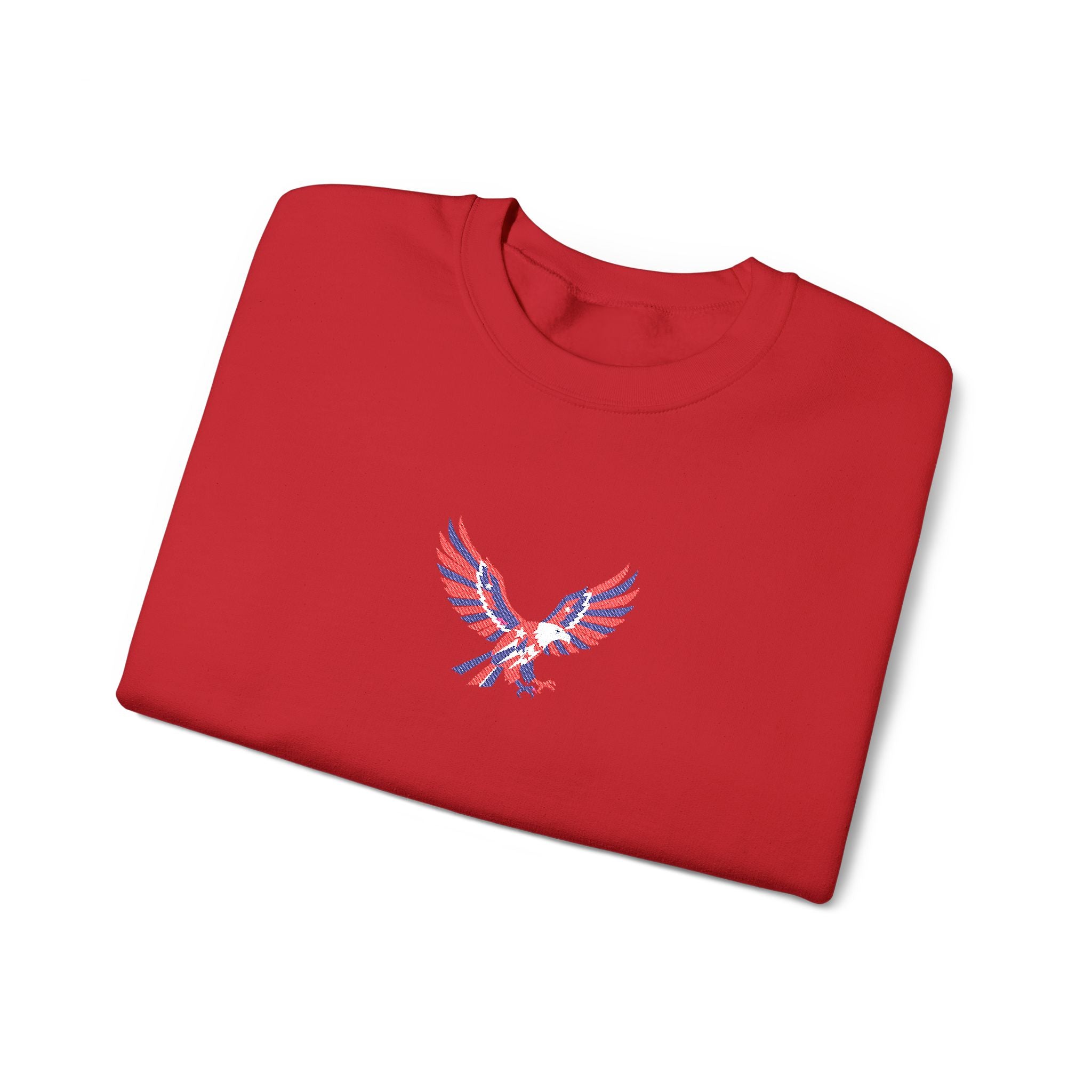 Folded red sweatshirt with an eagle emblem on a white background
