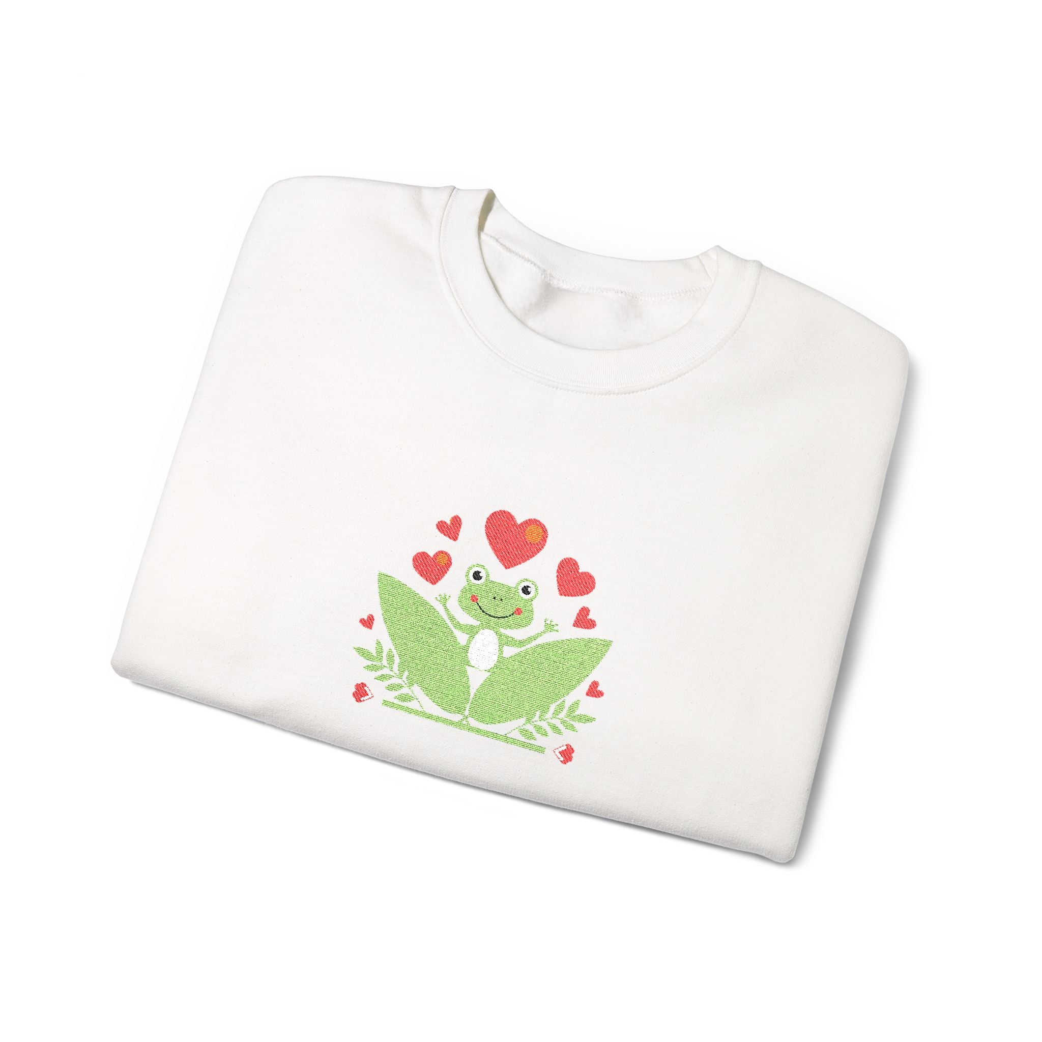 White sweatshirt with a green frog design and red hearts on a white background