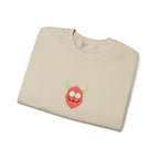 Folded beige sweatshirt with a red monster graphic on a white background