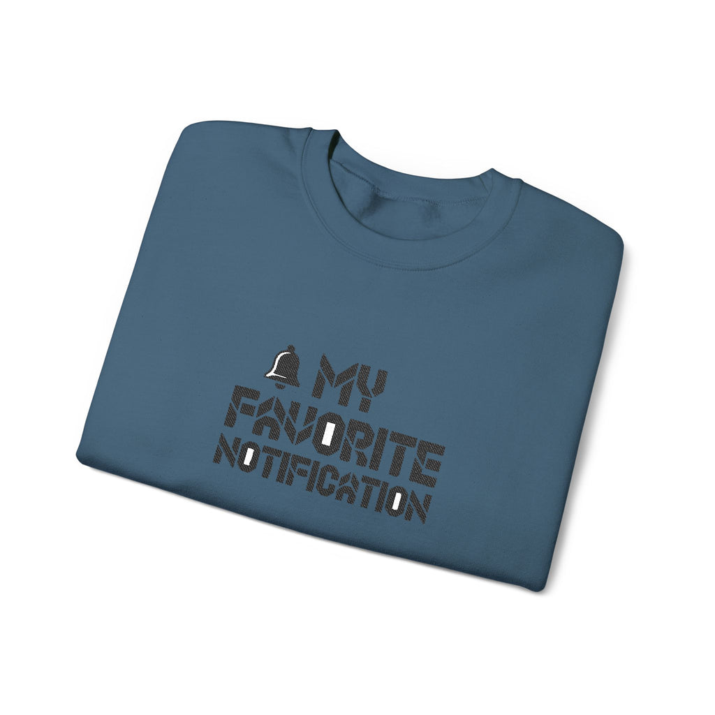 Folded blue t-shirt with text design on a white background