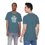 Two people wearing a teal t-shirt with 'I'm Here For You' text, one facing front and one facing back.