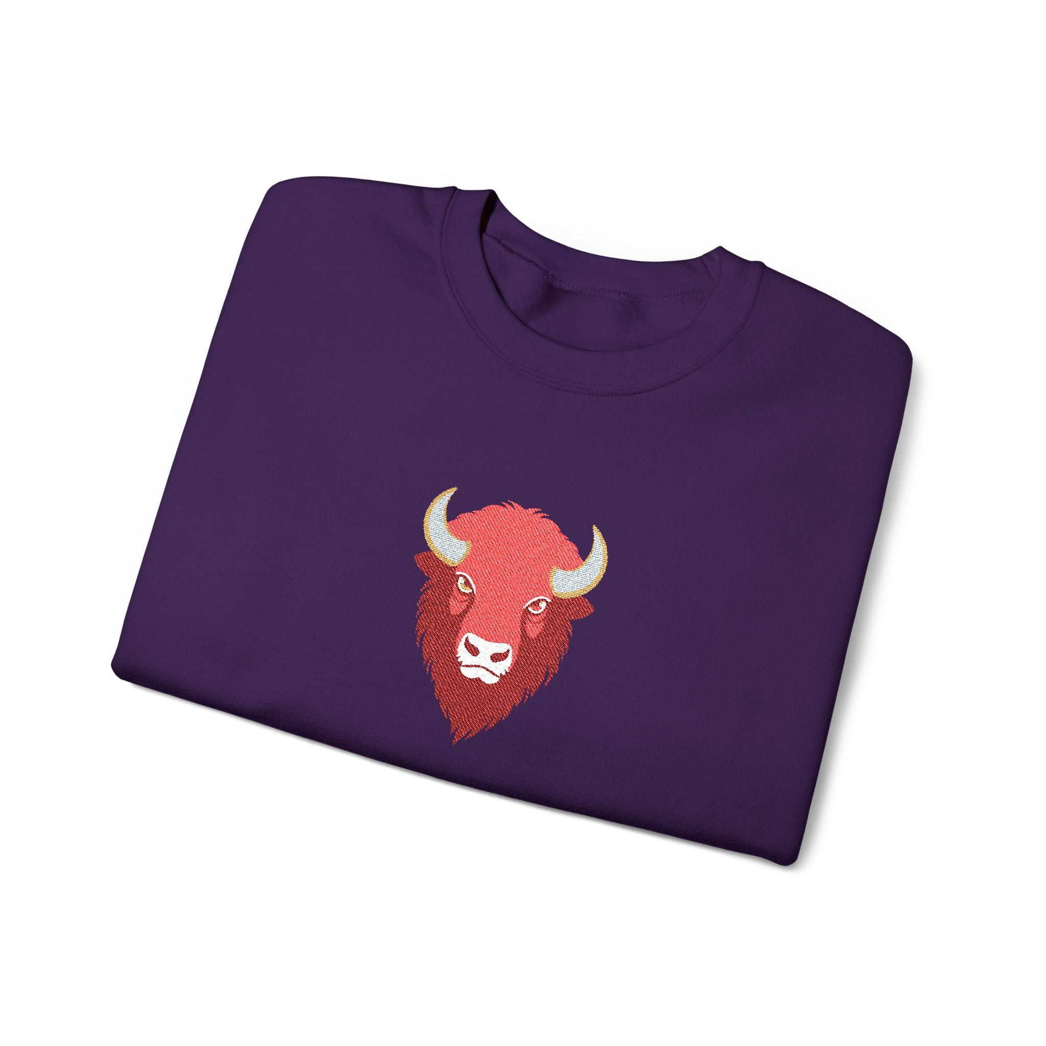 Folded purple sweatshirt with a red bull logo on a white background