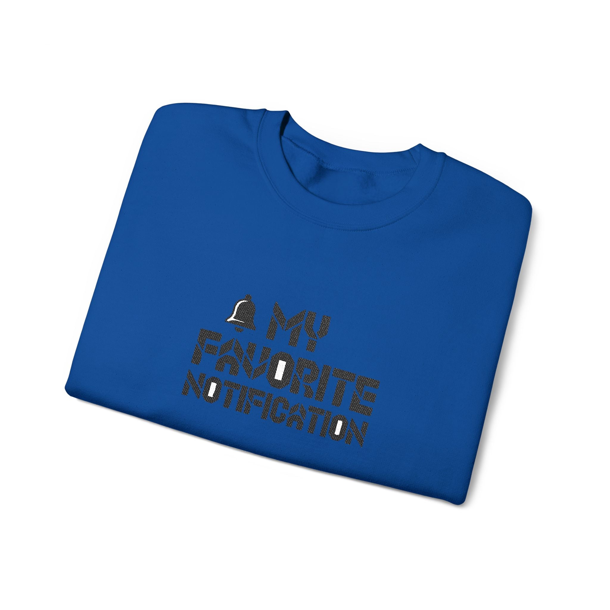 Folded blue t-shirt with text design on a white background