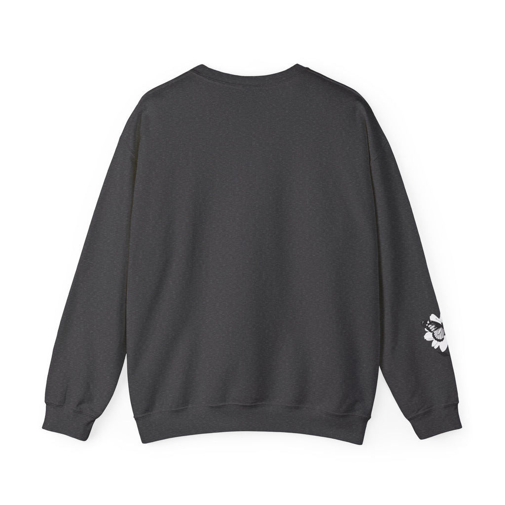 Black sweatshirt with a small white design on the sleeve against a white background