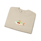 Folded beige t-shirt with a fish graphic on a white background