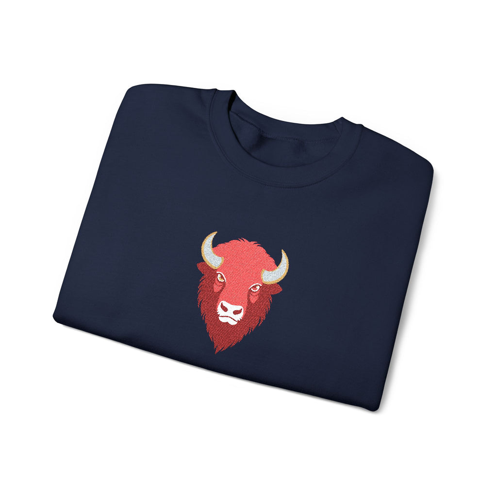 Folded navy blue sweatshirt with a red bull logo on a white background