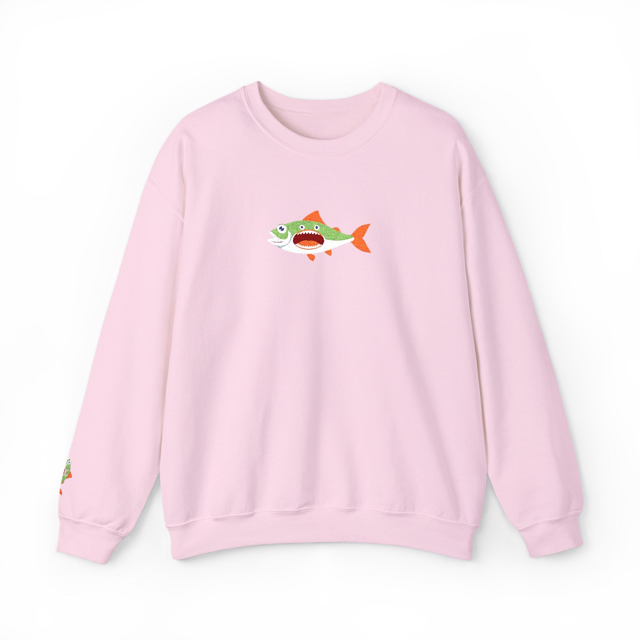 Pink sweatshirt with a cartoon shark design on a white background