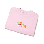 Folded pink sweatshirt with a fish graphic on a white background