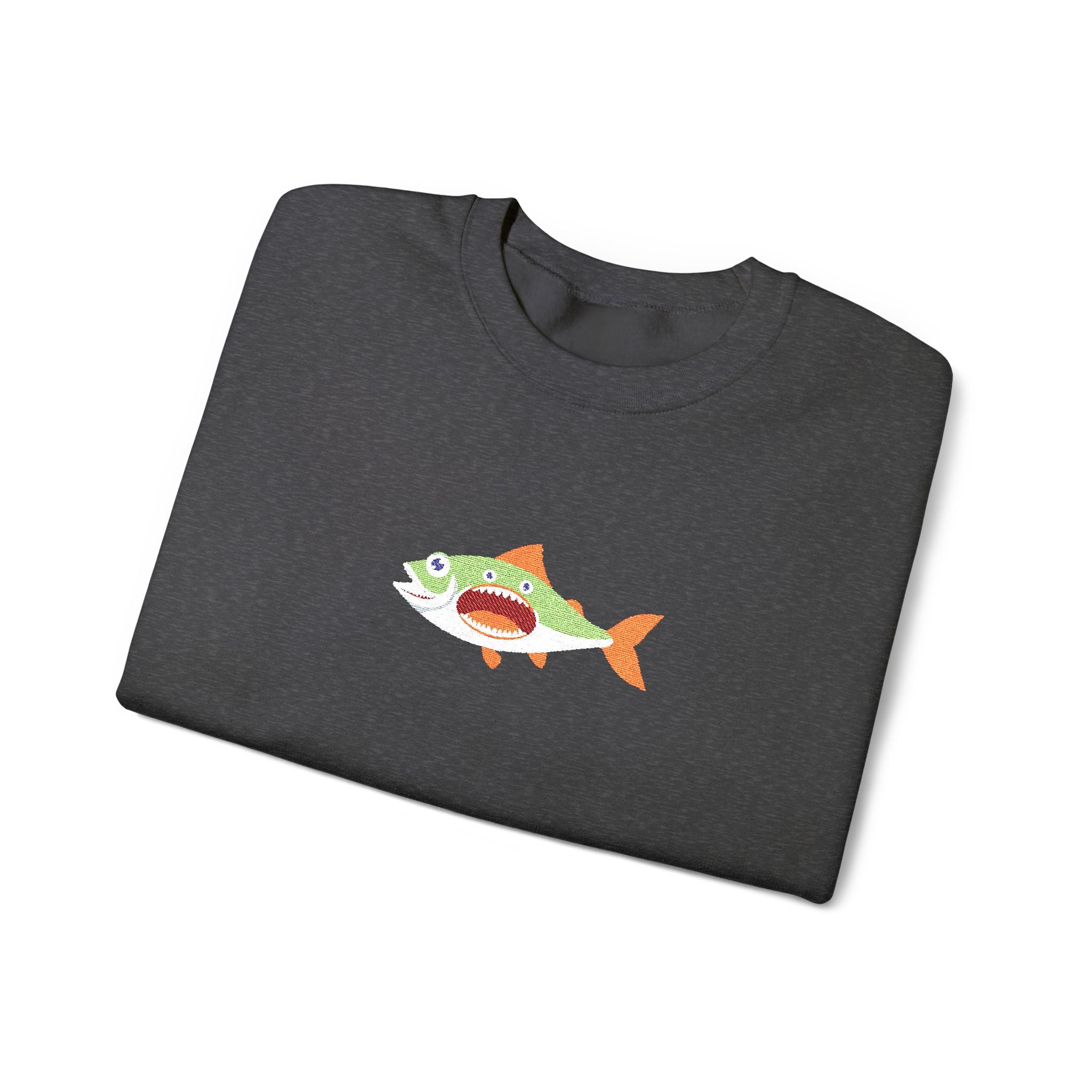 Folded dark gray t-shirt with a fish graphic on a white background