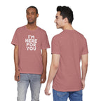 Two people wearing a red t-shirt with 'I'm here for you' text, one facing front and one facing back.