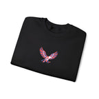 Folded black sweatshirt with a colorful eagle emblem on a white background