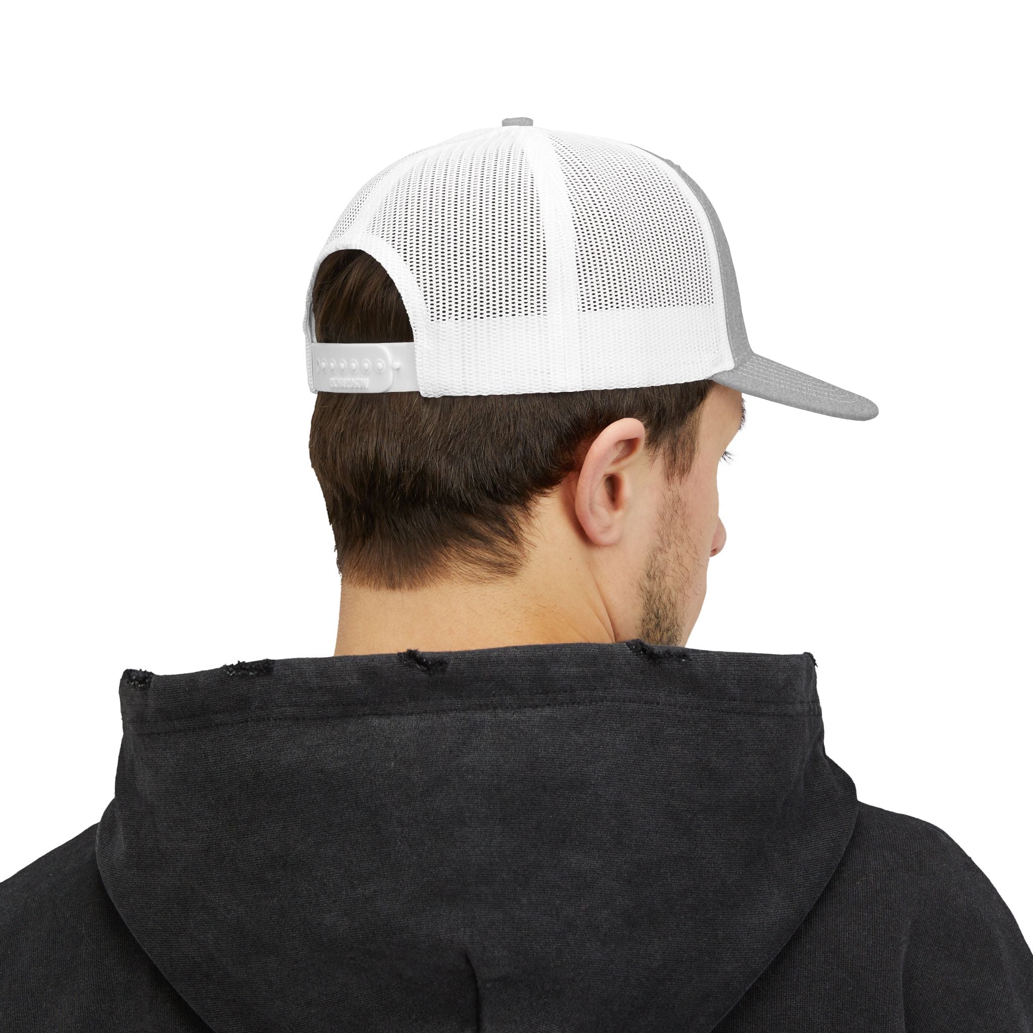 Person wearing a black hoodie and white and gray cap on a white background