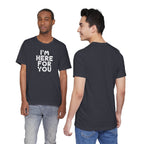 Two people wearing a black t-shirt with 'I'm Here For You' text, one facing front and one facing back.