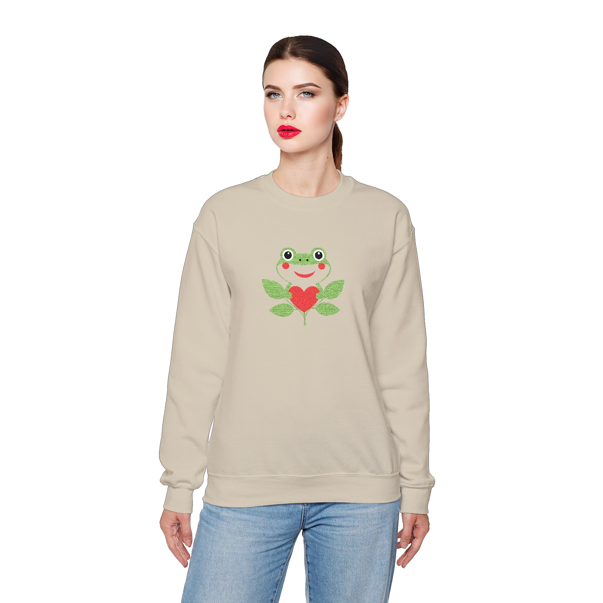 Woman wearing a beige sweatshirt with a graphic design on a white background