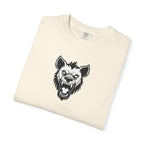 Folded cream-colored t-shirt with a black wolf graphic on a white background