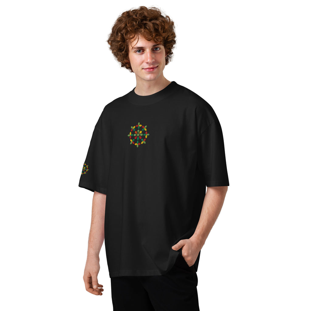 Person wearing a black t-shirt with a colorful design on a white background