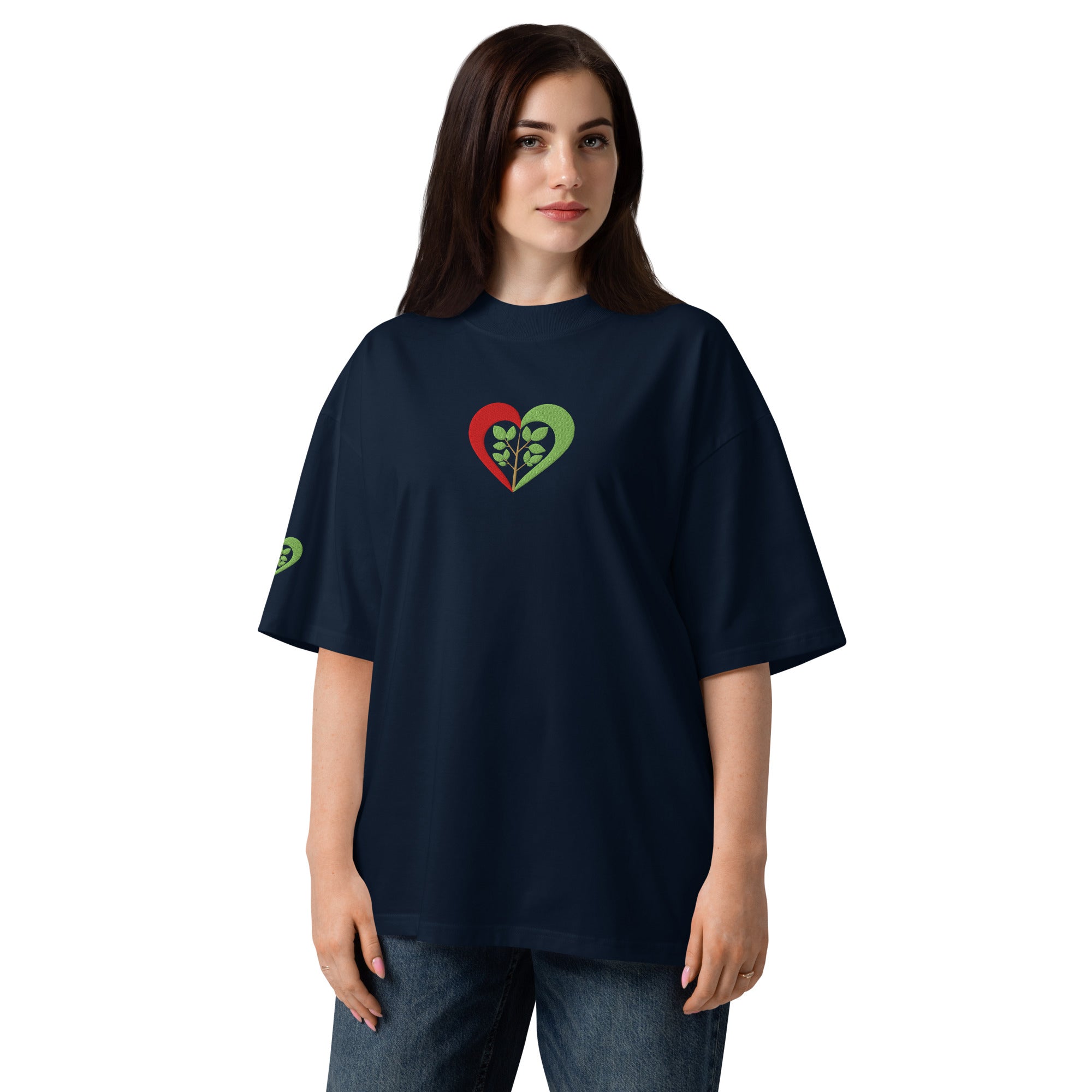 Person wearing a navy blue t-shirt with a heart design on a white background