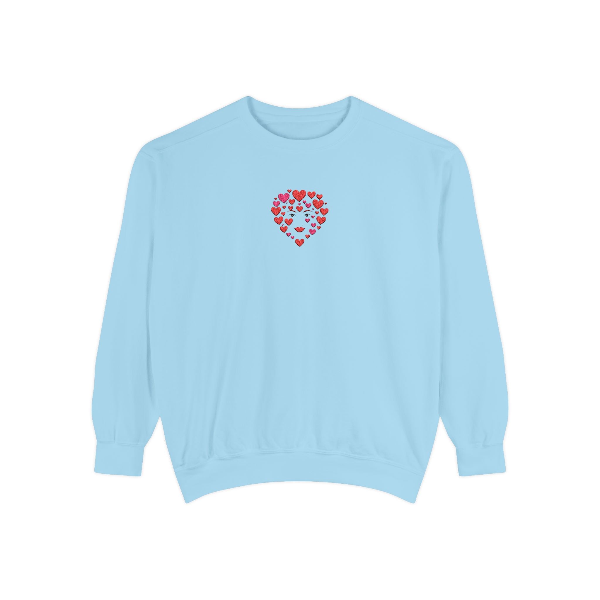 Light blue sweatshirt with a red heart pattern on a white background