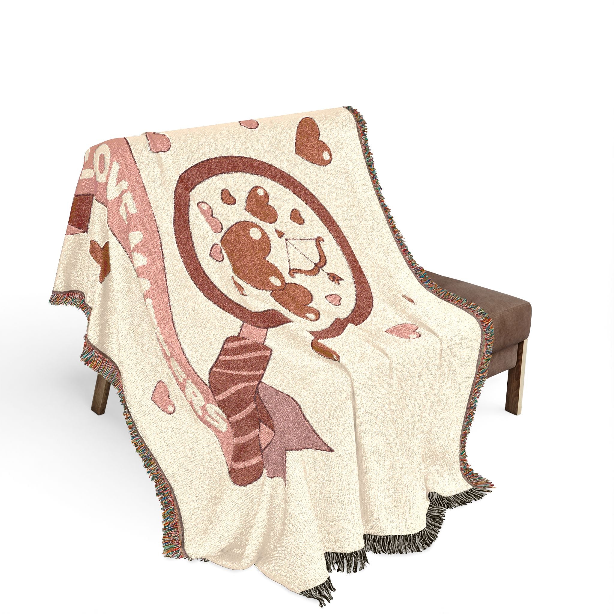 Decorative blanket with a cartoon character design draped over a chair on a white background