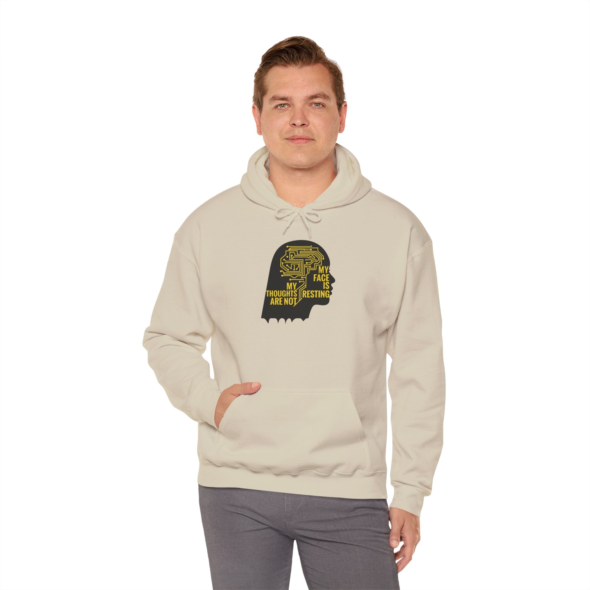 Man wearing a beige hoodie with a graphic design on a white background