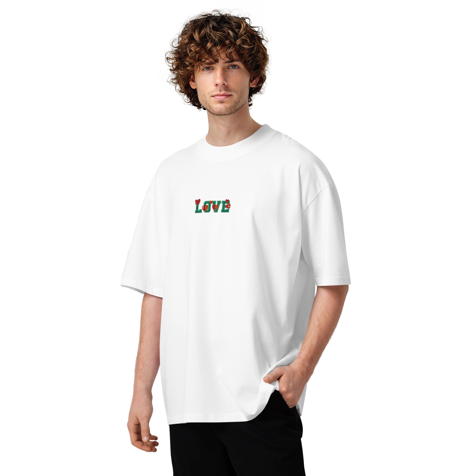 Person wearing a white t-shirt with colorful text on a white background