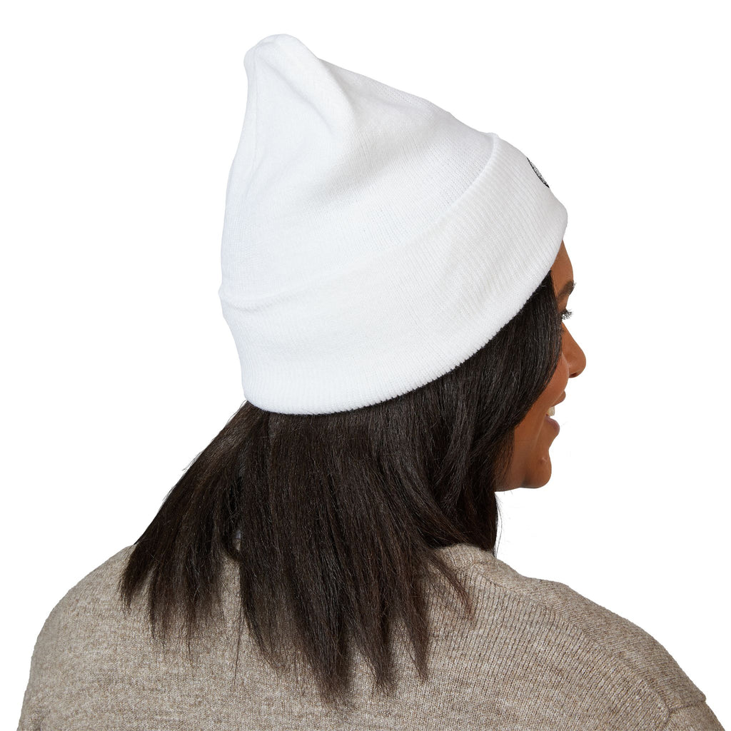 Person wearing a white beanie on a white background