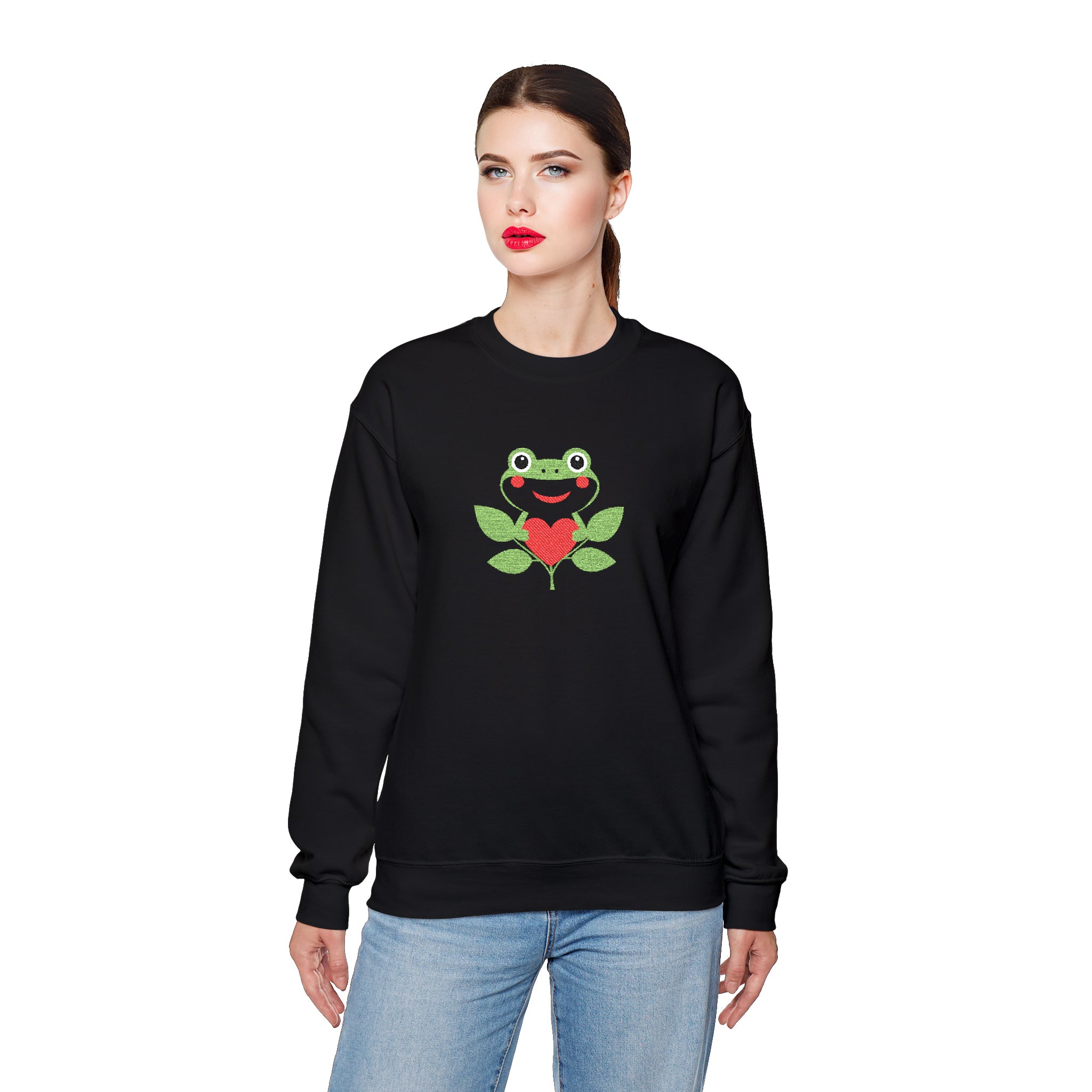Woman wearing a black sweatshirt with a frog and heart design on a white background