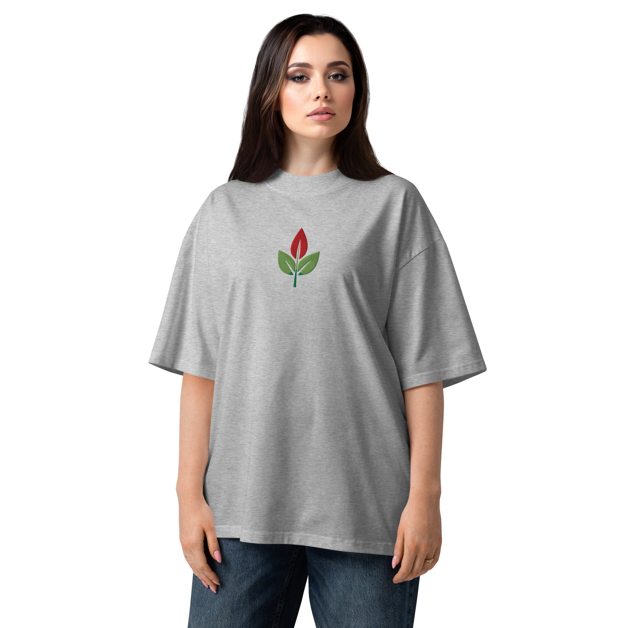 Woman wearing a gray t-shirt with a red flower design on a white background