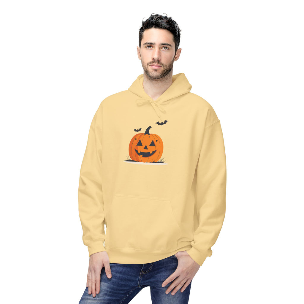 Man wearing a yellow hoodie with a Halloween pumpkin design on a white background