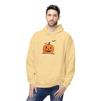 Man wearing a yellow hoodie with a Halloween pumpkin design on a white background