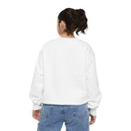 Person wearing a white sweatshirt and blue jeans on a white background