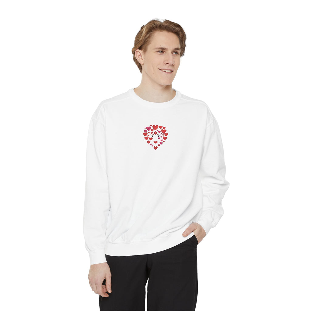 Man wearing a white sweatshirt with a red heart design on a white background