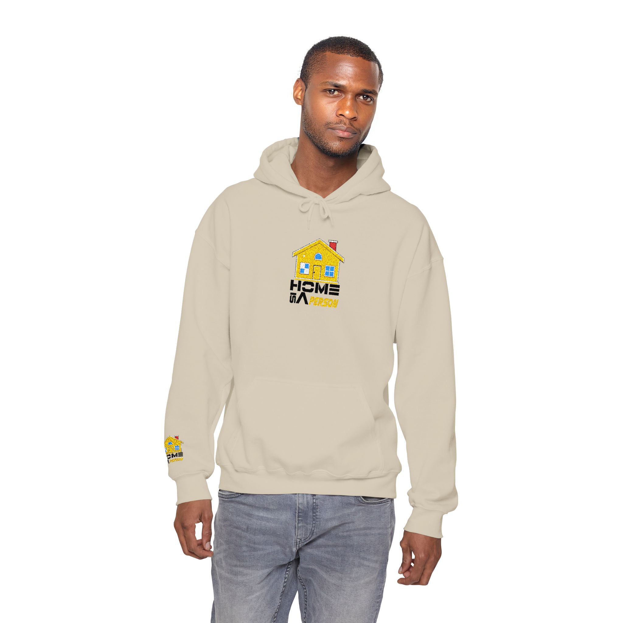 Man wearing a beige hoodie with a logo on a white background