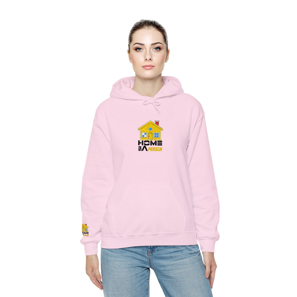 Person wearing a pink hoodie with a logo on a white background