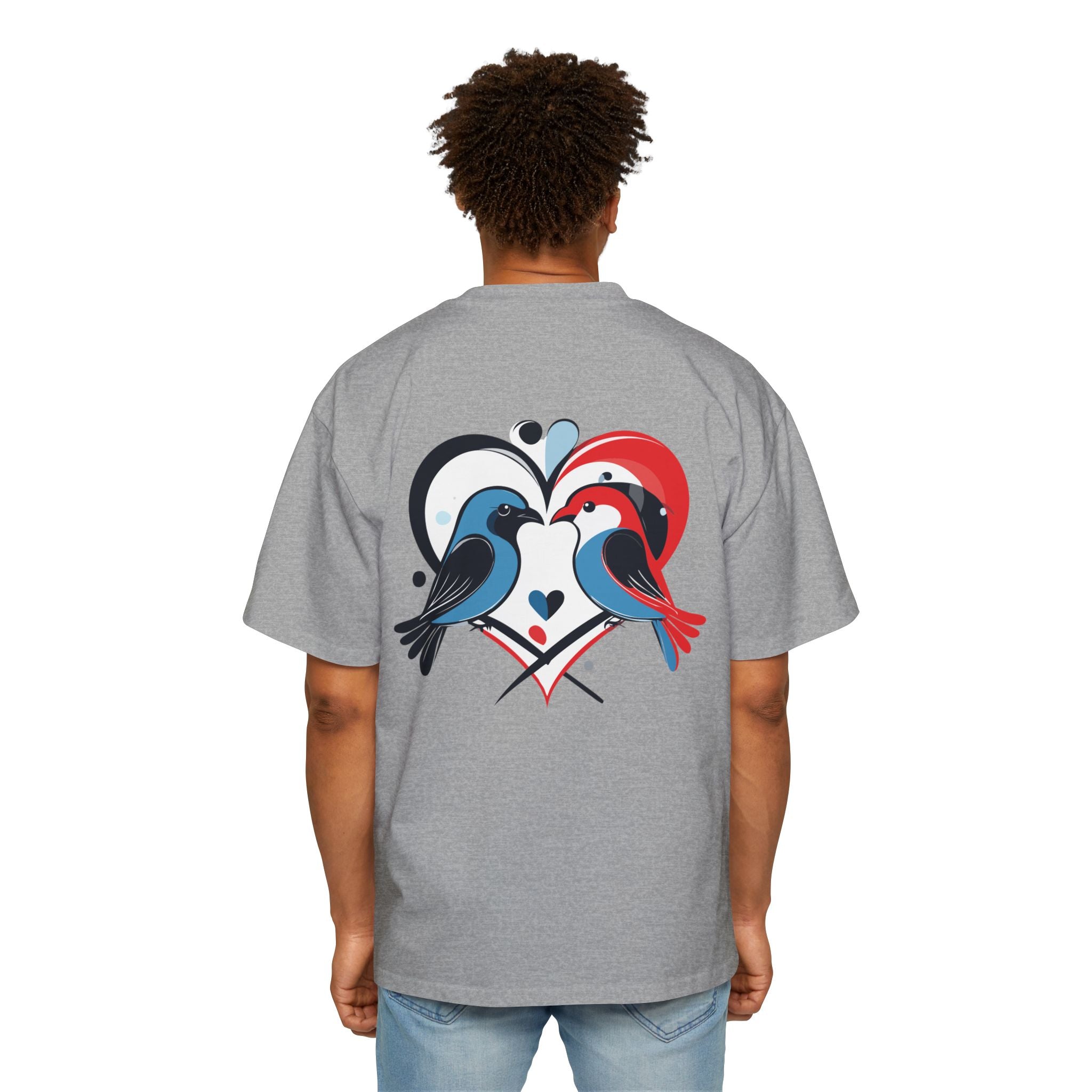 Person wearing a gray t-shirt with a colorful heart design on the back
