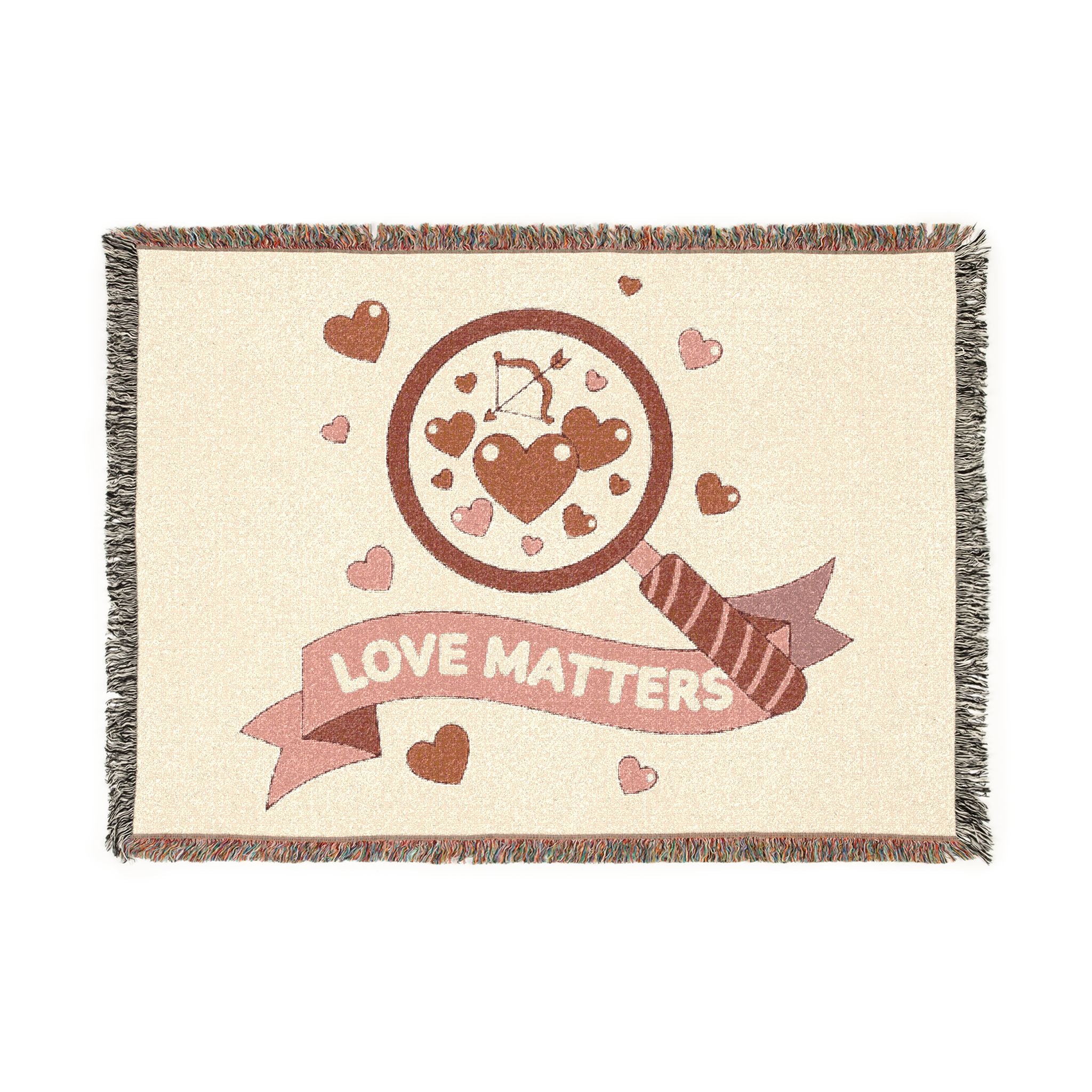 Blanket with 'Love Matters' design featuring hearts and an arrow on a beige background