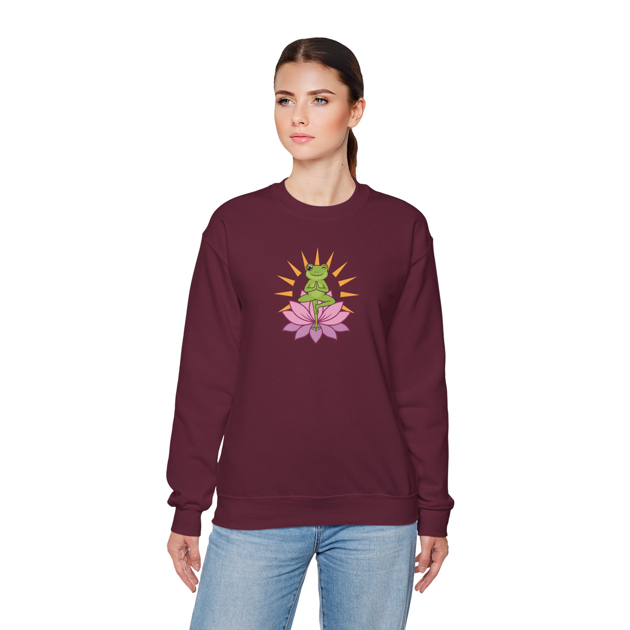 Person wearing a maroon sweatshirt with a graphic design on a white background