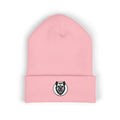 Pink beanie with a black and white logo on a white background