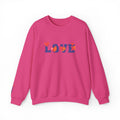 Pink sweatshirt with 'LOVE' and heart designs on a white background