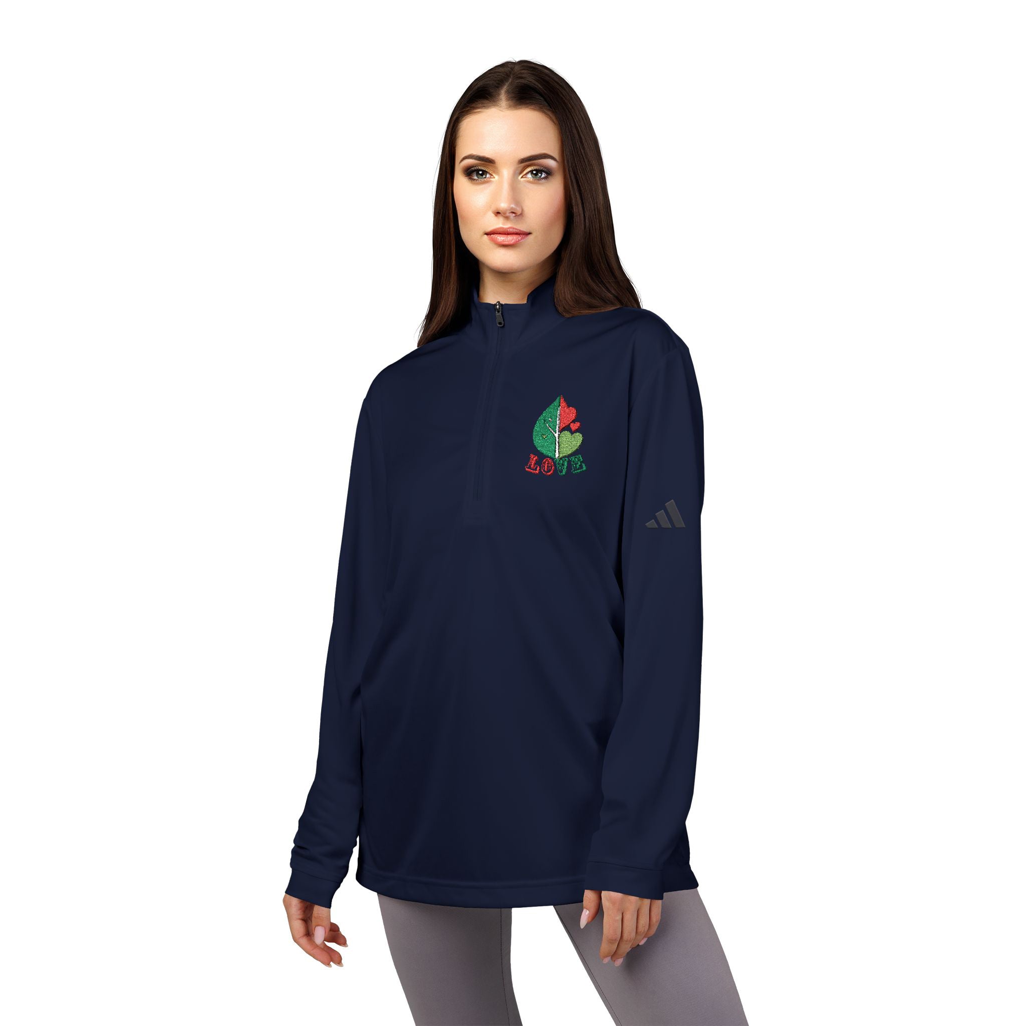 Woman wearing a navy blue Adidas sweatshirt with a colorful logo on a white background