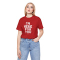 Person wearing a red t-shirt with 'I'm here for you' text on a white background