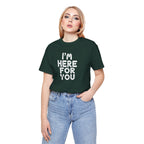 Woman wearing a green t-shirt with 'I'm here for you' text on a white background