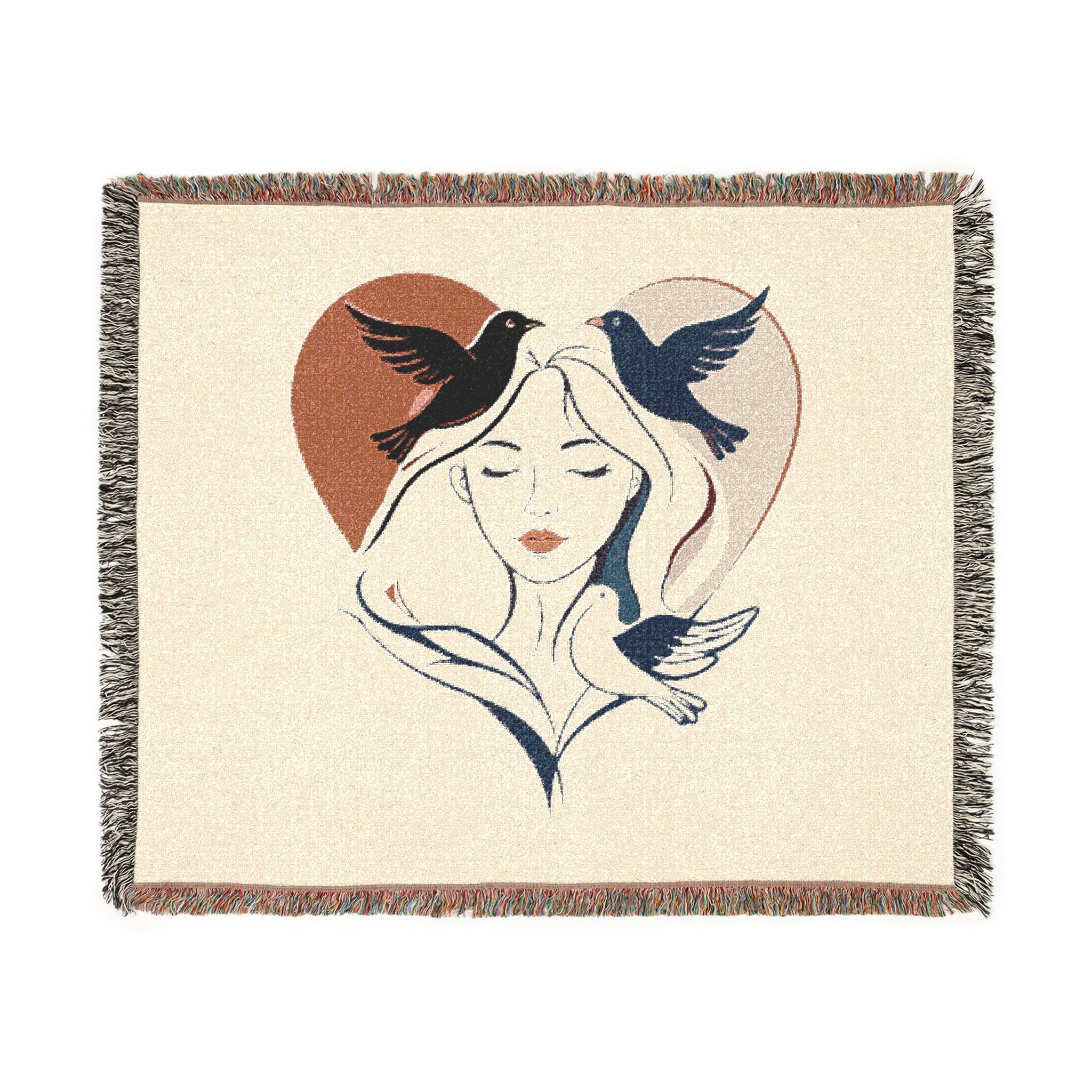 Woven blanket with a design of a woman's face, birds, and a heart on a beige background.