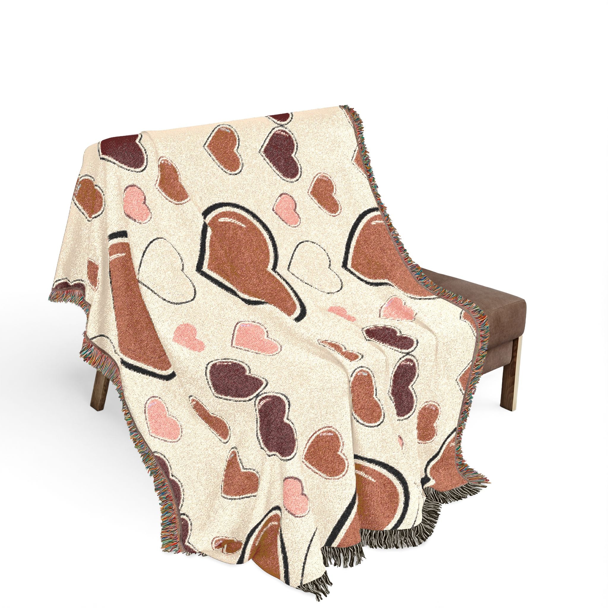 Decorative blanket with heart pattern draped over a chair on a white background